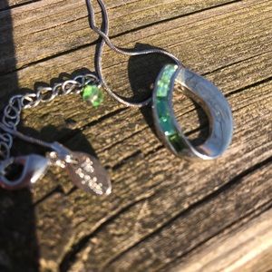Tear drop pendant: silver tone with green stones